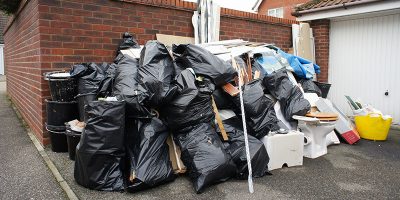 Stacks of waste bags outside a home in the UK